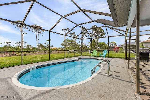 view of pool featuring a yard, a lanai, and a patio area