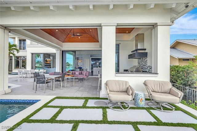 view of patio featuring an outdoor hangout area and exterior kitchen