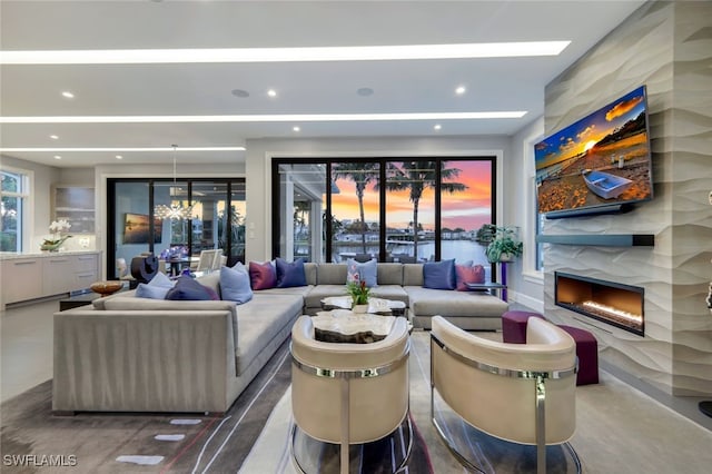 living room featuring concrete flooring and a fireplace