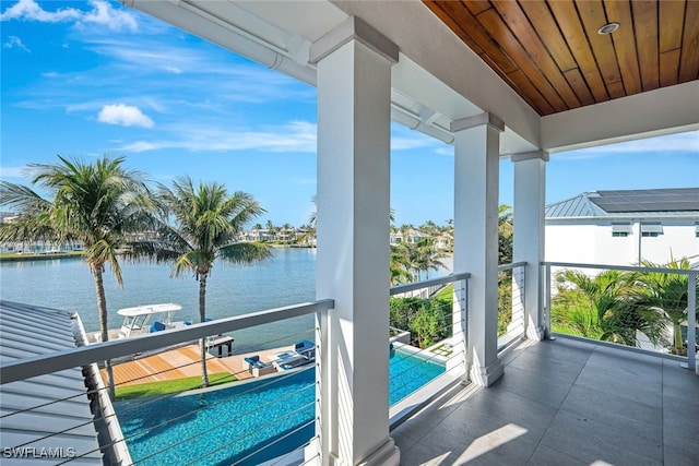 balcony featuring a water view