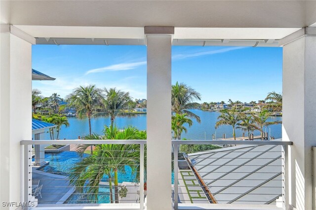 balcony featuring a water view