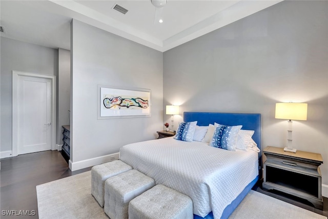 bedroom featuring dark hardwood / wood-style floors and ceiling fan