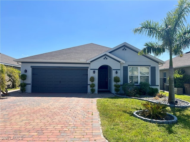 ranch-style house with a front yard and a garage