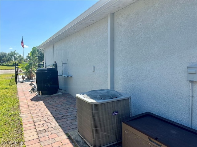 view of side of property featuring central AC unit