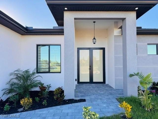 view of exterior entry featuring french doors