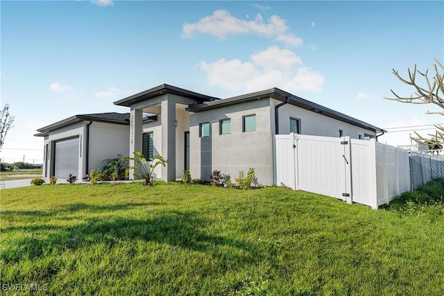 view of property exterior with a garage and a lawn