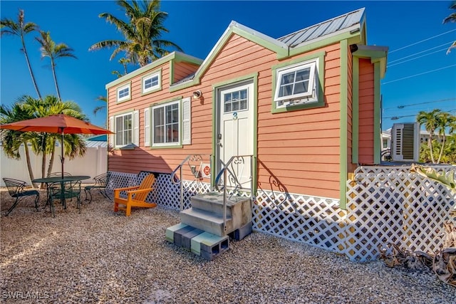 back of house with a patio