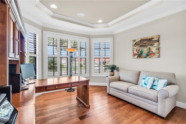 office space featuring hardwood / wood-style floors, plenty of natural light, and ornamental molding