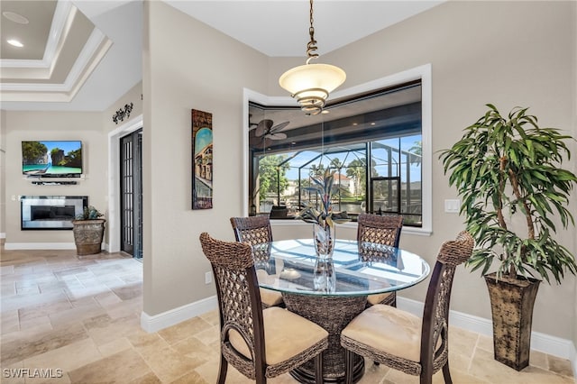 dining space with ornamental molding