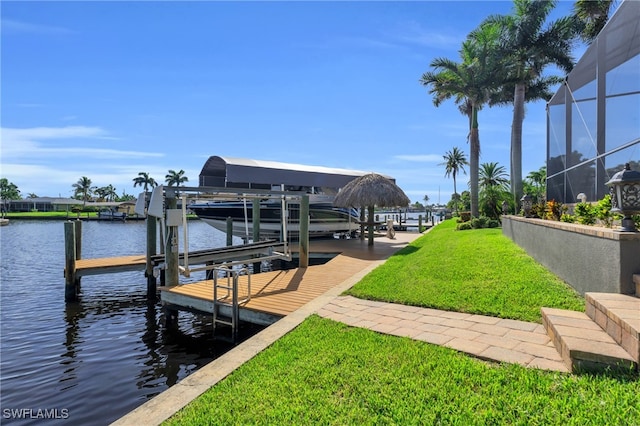 view of dock featuring a yard, a water view, and a lanai