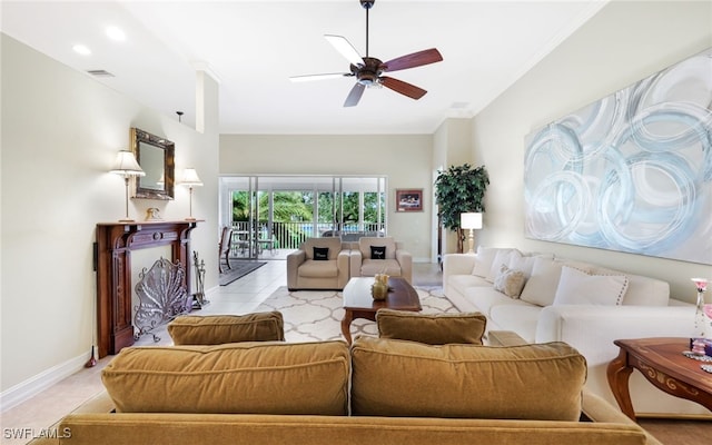 living room featuring ceiling fan, crown molding, and light tile patterned flooring