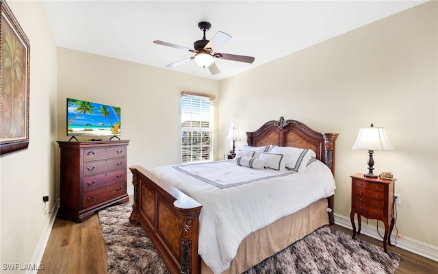 bedroom with ceiling fan and wood-type flooring