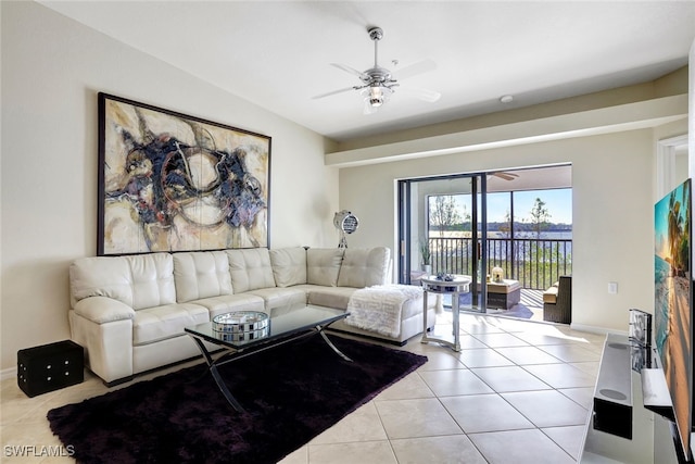 living room featuring ceiling fan and light tile patterned flooring