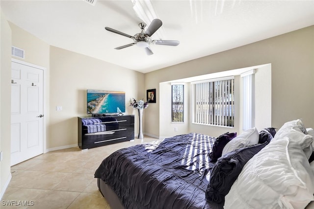 tiled bedroom with ceiling fan