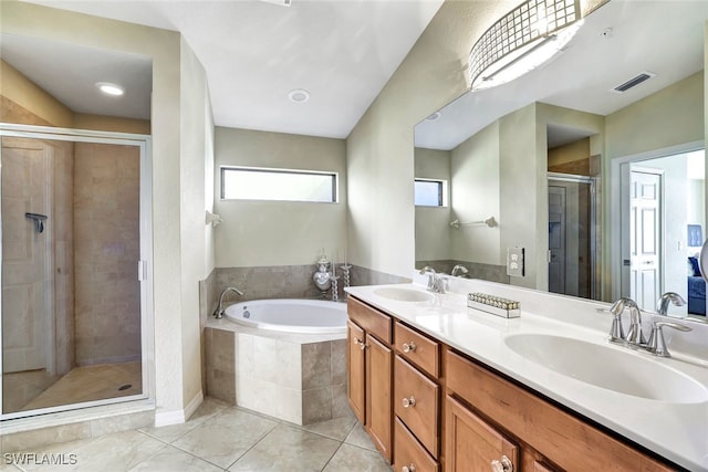 bathroom featuring tile patterned floors, vanity, and independent shower and bath