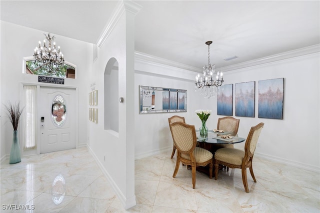 dining area with an inviting chandelier, crown molding, visible vents, and marble finish floor