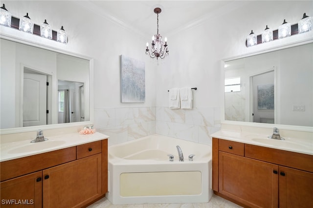 bathroom with a garden tub, two vanities, and a sink