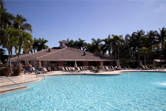 community pool with a patio area