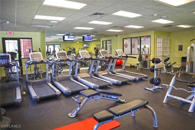 gym with visible vents, french doors, and a drop ceiling