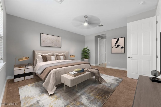 bedroom featuring visible vents, baseboards, a ceiling fan, and carpet flooring