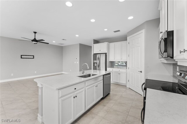 kitchen with white cabinetry, an island with sink, appliances with stainless steel finishes, and sink