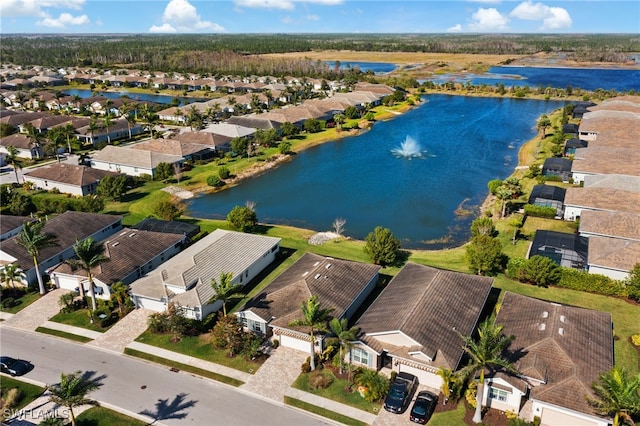 aerial view featuring a residential view and a water view