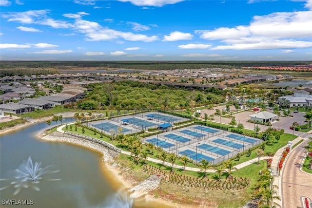 birds eye view of property with a residential view and a water view