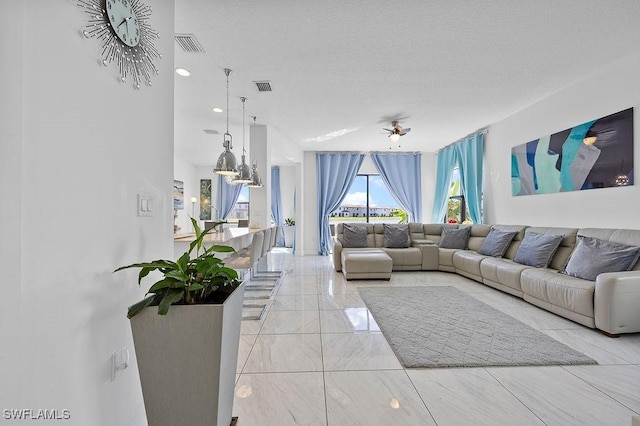 living room featuring a textured ceiling