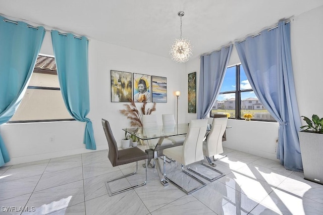 dining space featuring a chandelier