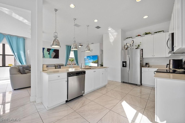 kitchen featuring white cabinets and stainless steel appliances