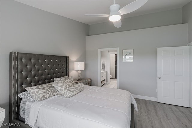 bedroom featuring connected bathroom, ceiling fan, and light wood-type flooring