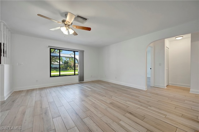 spare room featuring ceiling fan and light hardwood / wood-style floors