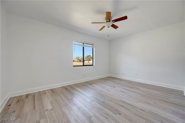 empty room with ceiling fan and light wood-type flooring