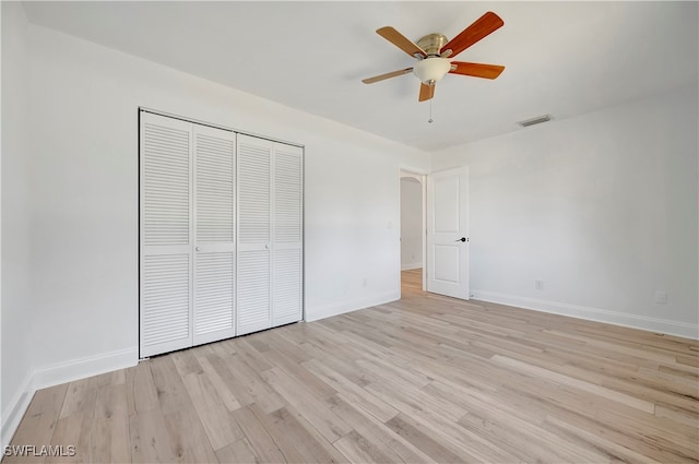 unfurnished bedroom with a closet, ceiling fan, and light hardwood / wood-style flooring