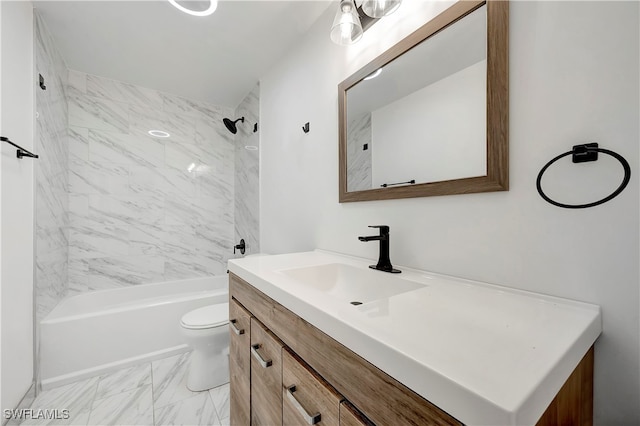 full bathroom featuring vanity, tiled shower / bath combo, and toilet