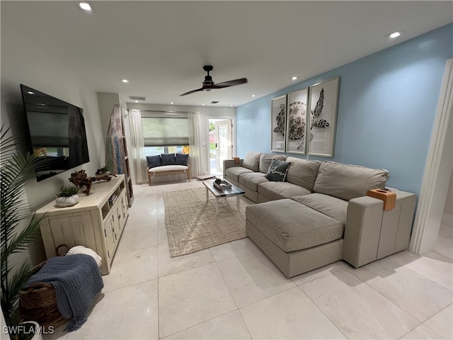 living room featuring light tile patterned floors and ceiling fan