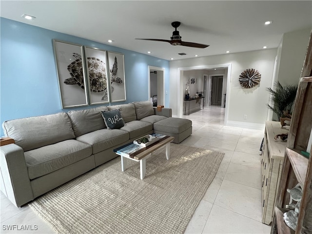 living room with light tile patterned floors and ceiling fan