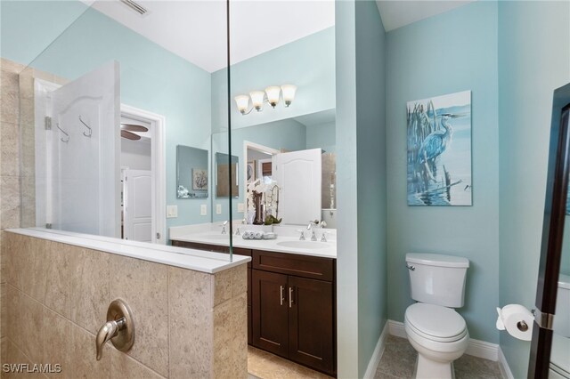 bathroom with tile patterned floors, vanity, and toilet