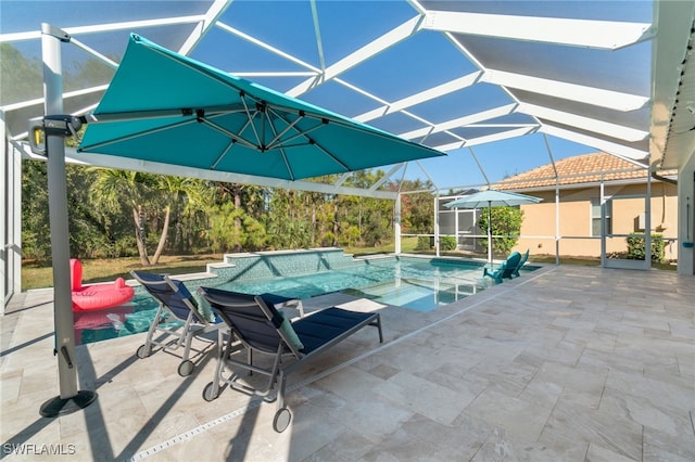 view of swimming pool featuring a patio and a lanai