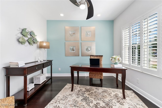 home office featuring dark hardwood / wood-style floors and ceiling fan