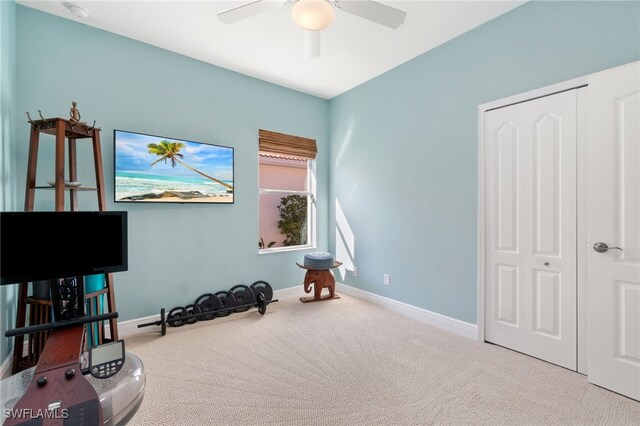 interior space featuring carpet flooring and ceiling fan