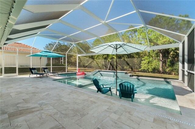 view of swimming pool with a lanai and a patio area