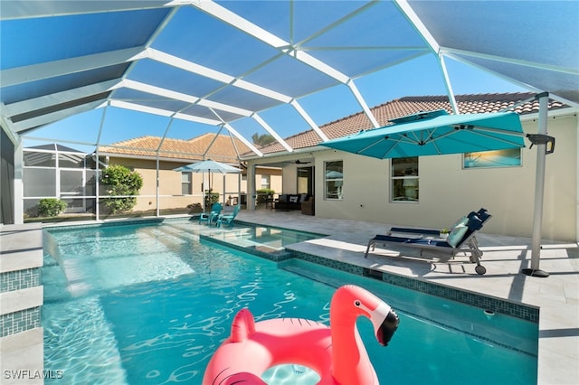 view of pool featuring a lanai and a patio