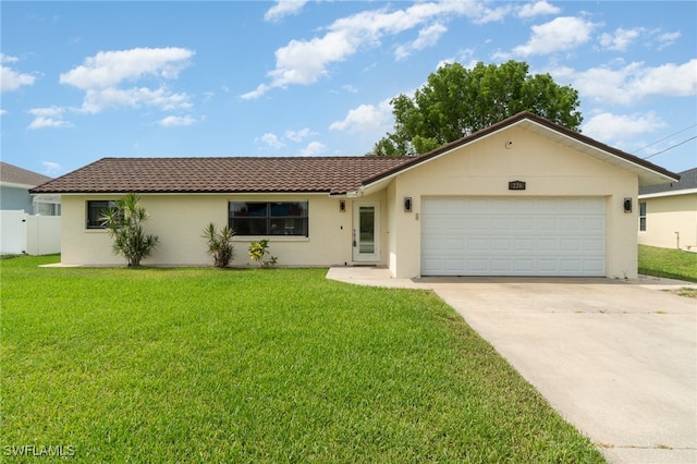 ranch-style home with a garage and a front lawn