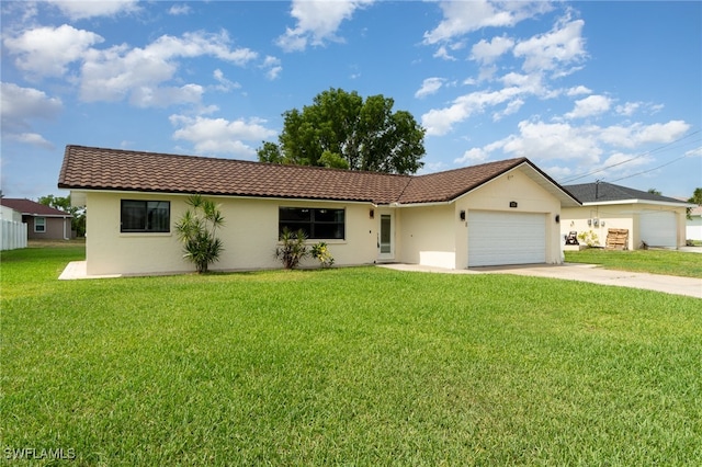 ranch-style home featuring a front yard and a garage