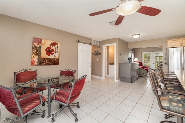 dining room with ceiling fan, light tile patterned flooring, and french doors