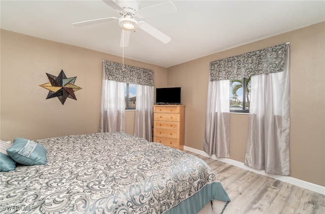 bedroom featuring hardwood / wood-style floors and ceiling fan