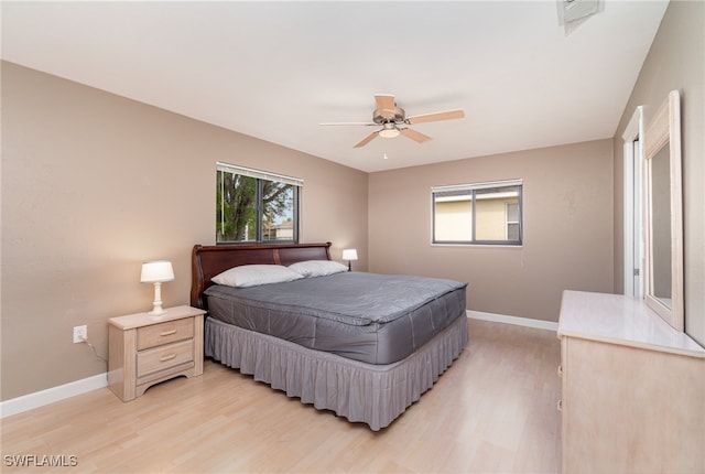 bedroom featuring ceiling fan and light hardwood / wood-style floors