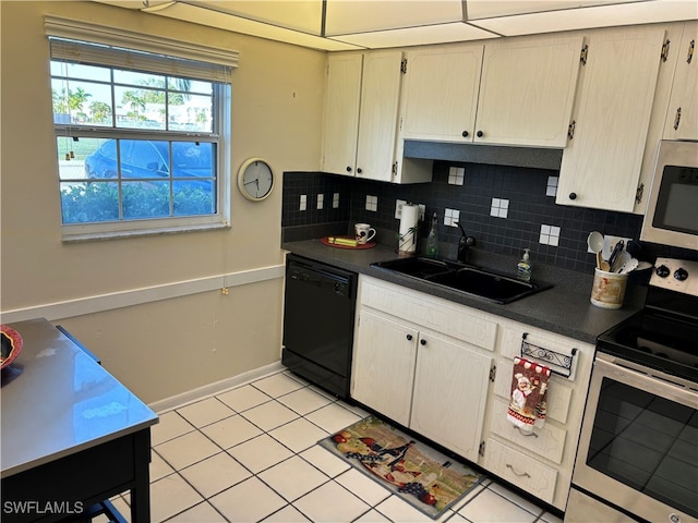 kitchen with tasteful backsplash, sink, light tile patterned flooring, and appliances with stainless steel finishes