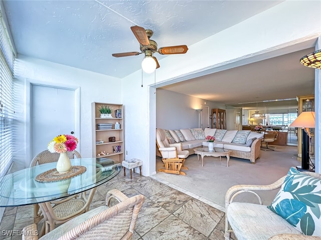 living room featuring ceiling fan